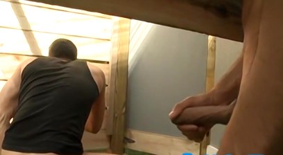 Gay Hunk is Sucking two Dicks in an outside Toilet Area