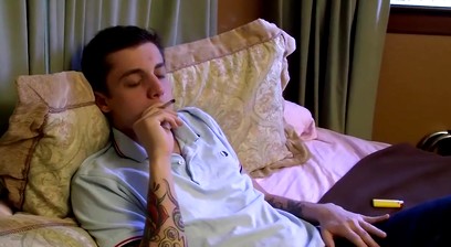 Inked bad boy Chris Porter smokes cigars while masturbating