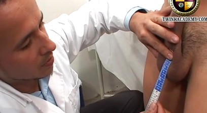 The campus doctor measures the Latino boy's uncut cock