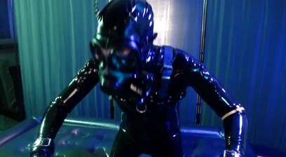 Rubberboy with gas mask pisses and cums